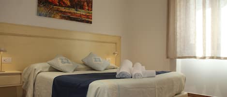 Comfort Room, 1 Bedroom, Ensuite, Courtyard View | Minibar, desk, laptop workspace, free WiFi