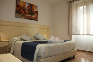 Comfort Room, 1 Bedroom, Ensuite, Courtyard View | Minibar, desk, laptop workspace, free WiFi