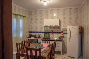 Fridge, stovetop, electric kettle, cookware/dishes/utensils