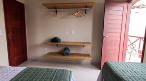 A room with two beds, wooden shelves, and a door. - Dunas de Amaro Chalet: 3 Suites, Pool & Viewpoint (Santo Amaro)