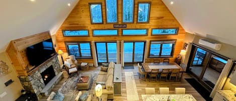 Smart TV, fireplace, books, computer monitors