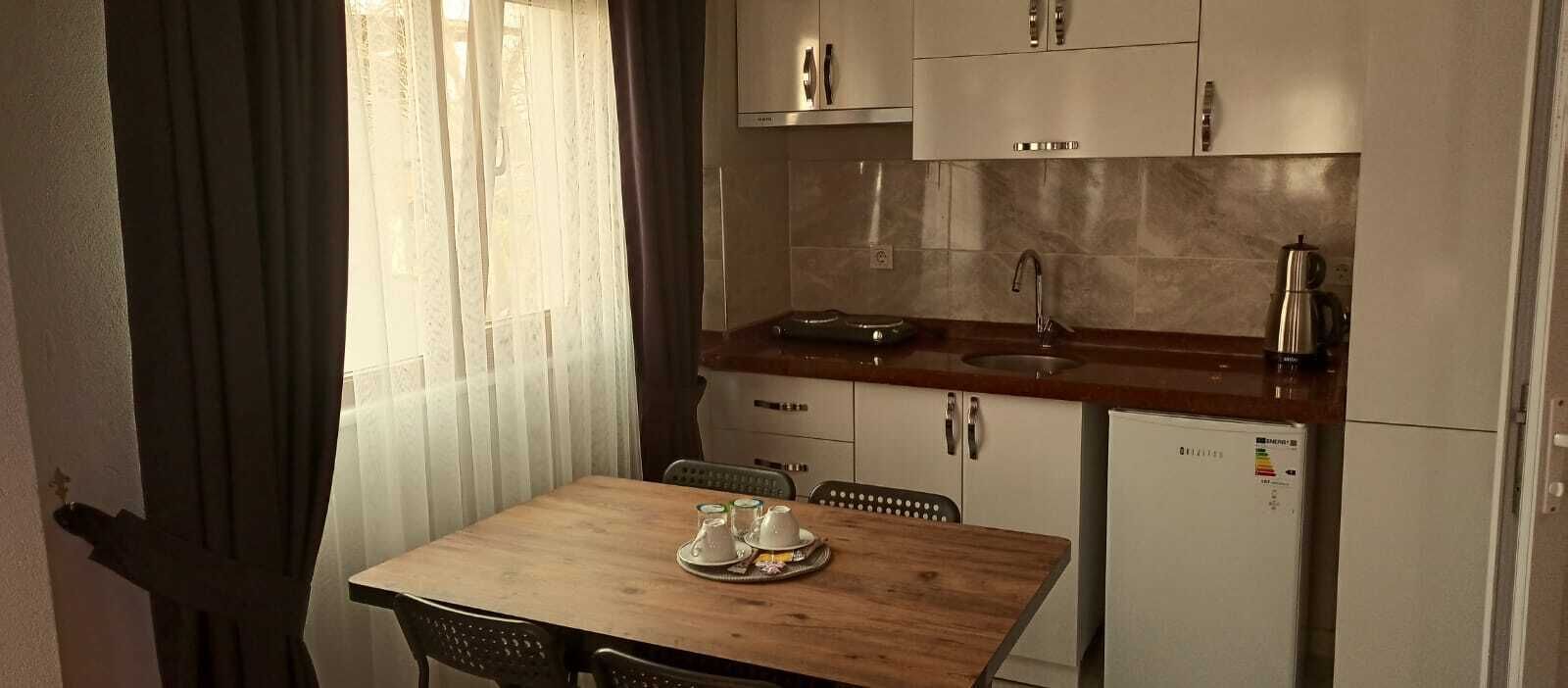 Apartment | Private kitchen | Mini-fridge, cookware/dishes/utensils