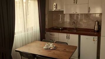 Apartment | Private kitchen | Mini-fridge, cookware/dishes/utensils