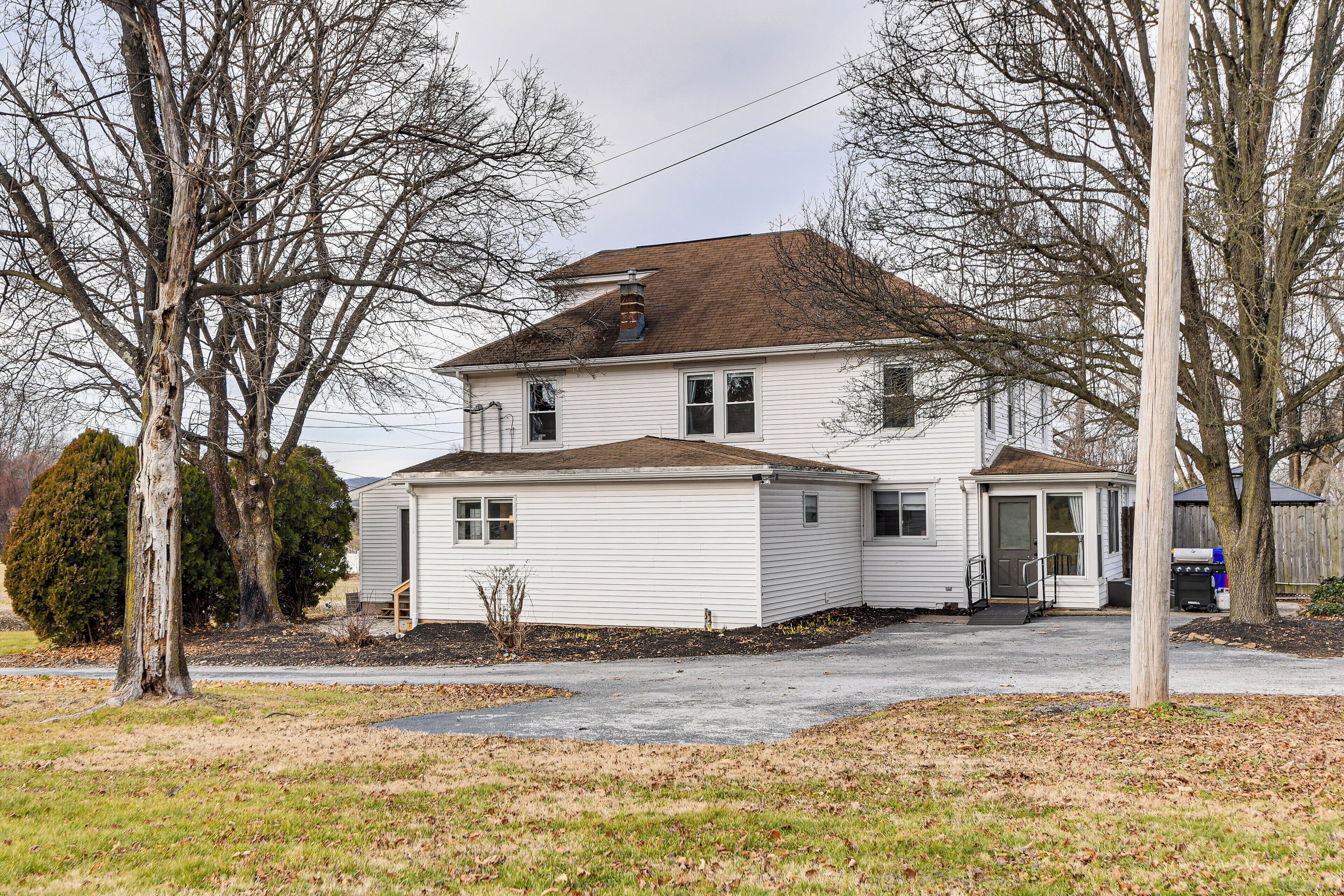 A two-story house with a front porch and a garage.