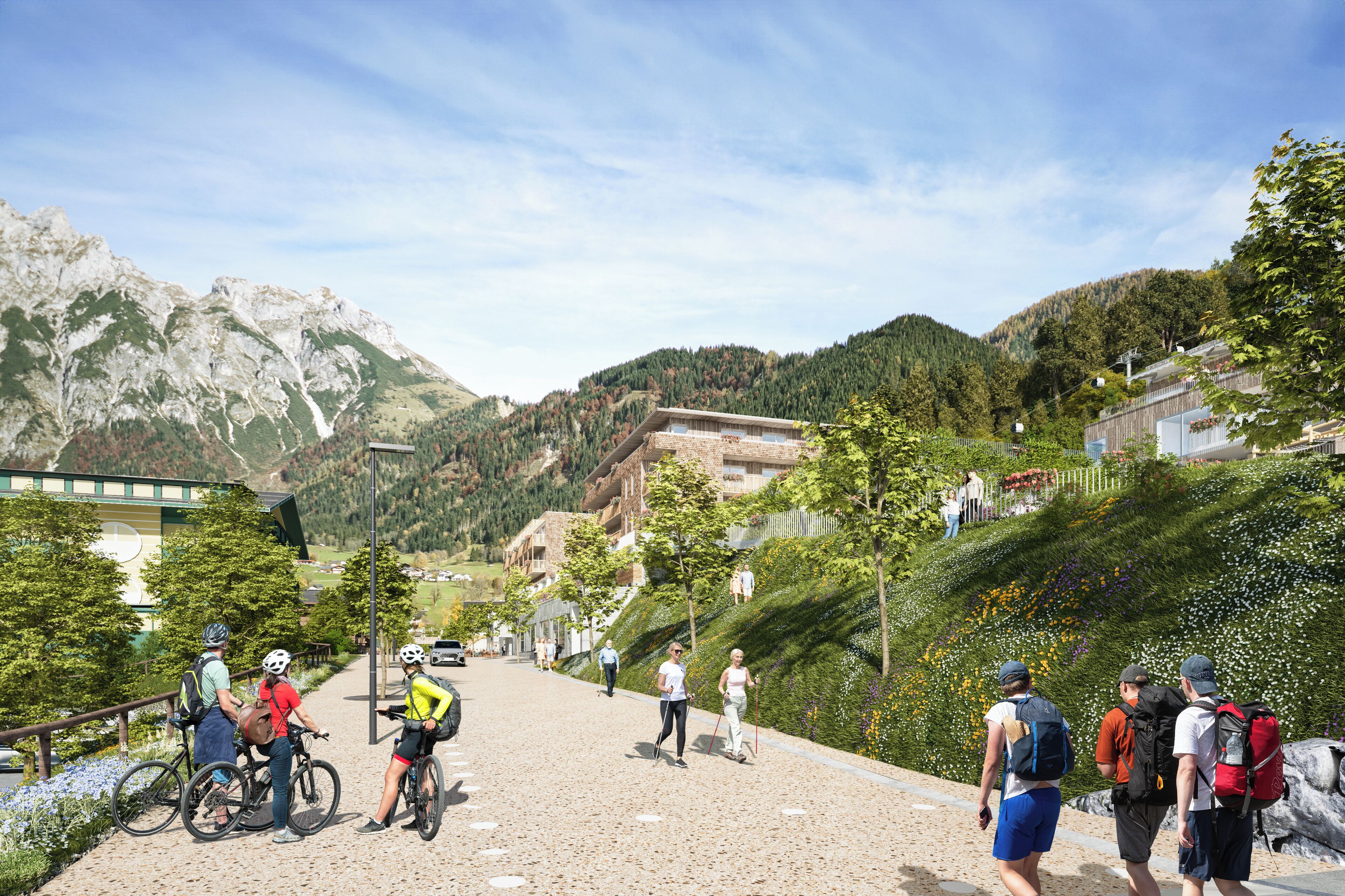 En asfalteret sti med cyklister og fodgængere, omgivet af grøn vegetation og bjerge.