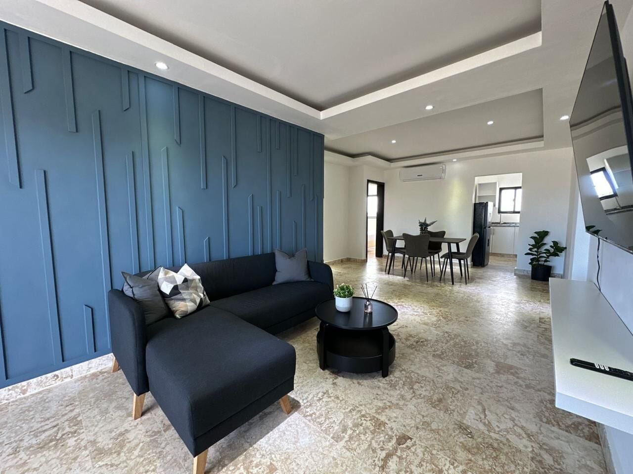 Penthouse familiar | Área de sala de estar | Televisión de pantalla plana 