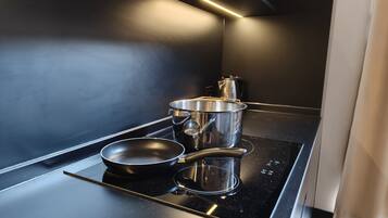 Microwave, toaster, cookware/dishes/utensils, dining tables