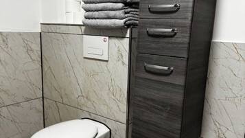 Shower, hair dryer, towels, soap