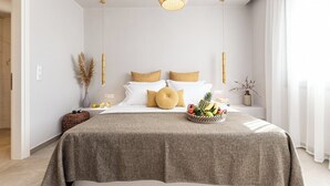 Een moderne slaapkamer met een neutrale kleurenpalet, een bed met een grijze plaid, een nachtkastje met een fruitschaal en een hanglamp.
