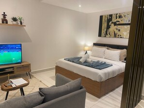 Suite estudio Deluxe, balcón, vista a la ciudad | Interior