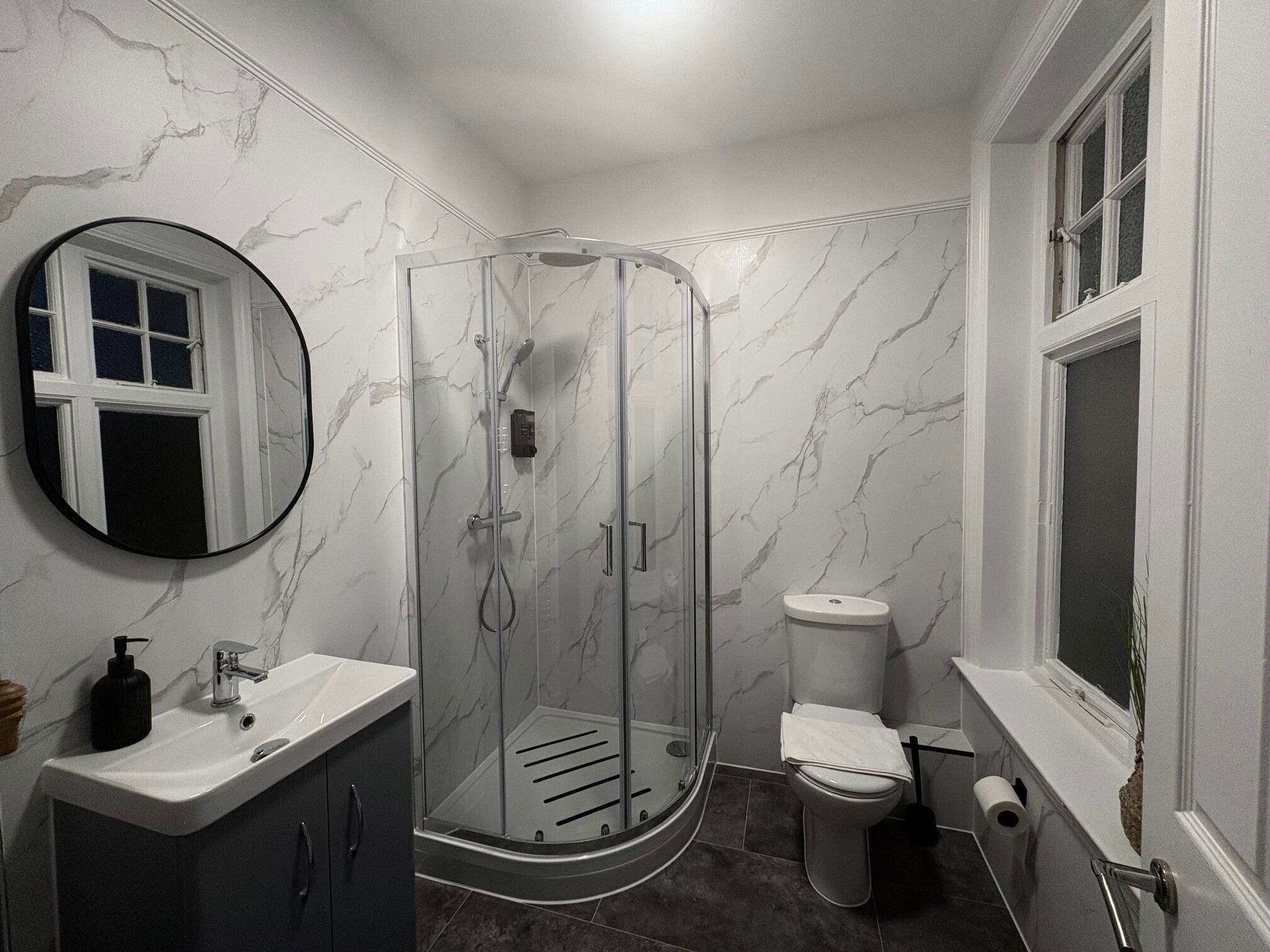 Shower, hair dryer, towels, soap