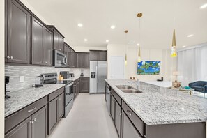 Fridge, microwave, oven, stovetop - Modern 5BR Home w/ Pool at Windsor Island (Davenport)
