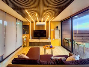 Suite, vista al océano | Área de sala de estar