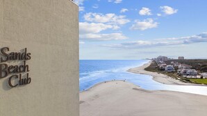A beach view with a sign for Sands Beach Club. - 🌴Oceanfront | Beach Views | Family Friendly Amenities | Sands Beach Club-214🌴 (Myrtle Beach)