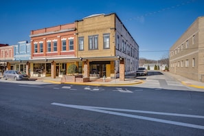 A street with multi-story buildings, a sidewalk, and a crosswalk. - The Downtown Post (Elizabethton)