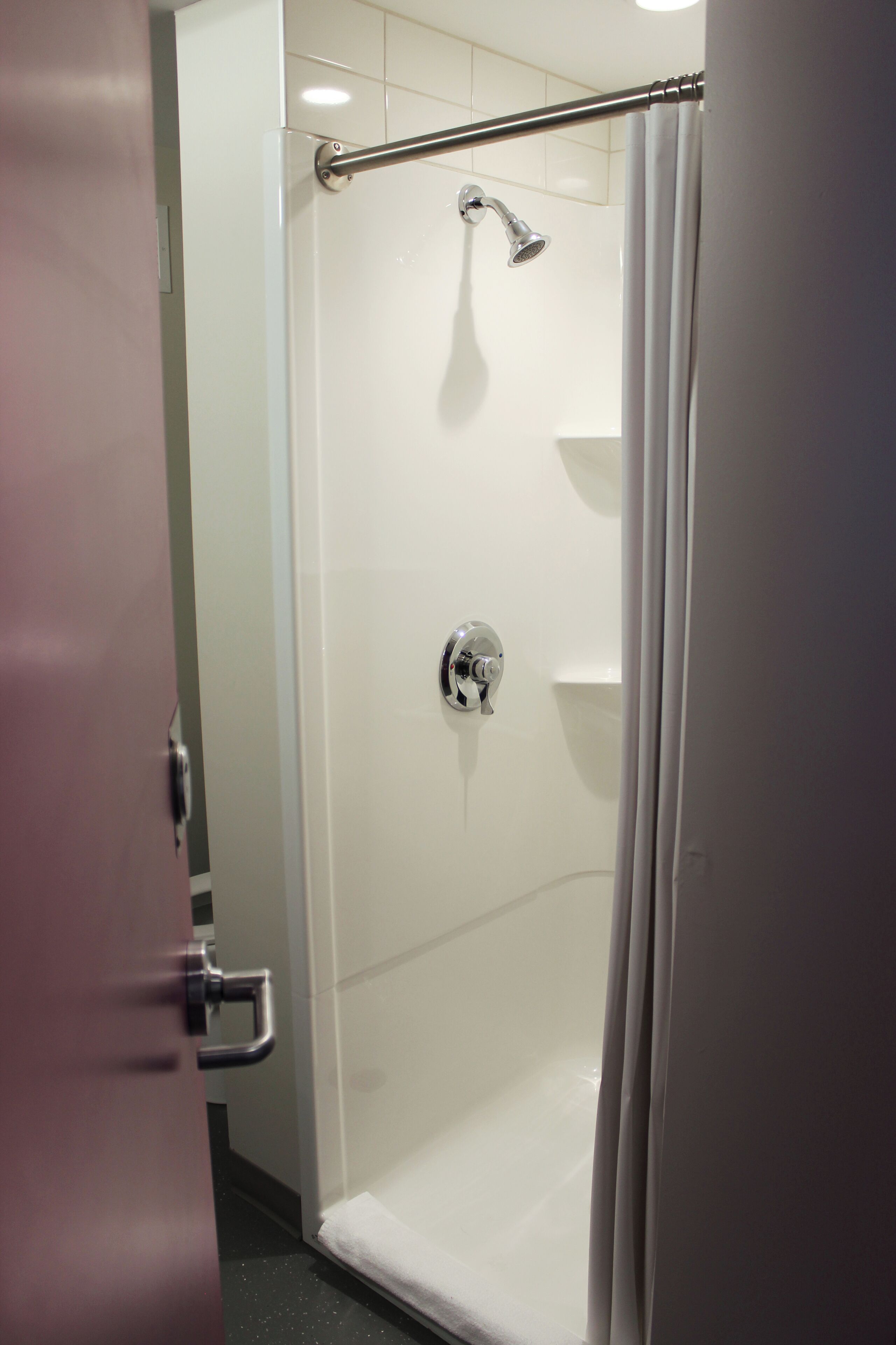 Economy Suite | Bathroom | Shower, free toiletries, towels, soap