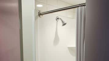Economy Suite | Bathroom | Shower, free toiletries, towels, soap