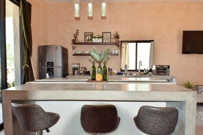 Fridge, stovetop, coffee/tea maker, electric kettle