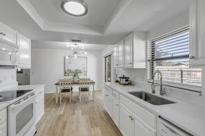 Microwave, oven, stovetop, dishwasher - Blue Door River House - Fenced Yard & Pet Friendly - Steps to the ICW (Edgewater)