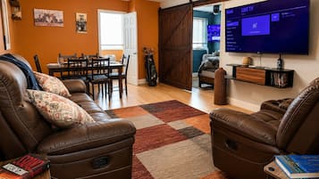 Deluxe Apartment, 3 Bedrooms, Pool Access, City View | Living area | 55-inch Smart TV with digital channels