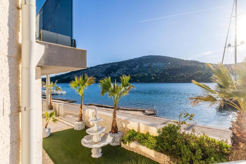 Villa Deluxe, balcón, vistas a la playa | Jardines del alojamiento