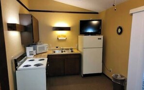 Fridge, microwave, oven, coffee/tea maker - One of our two large deluxe two-bedroom condo style units at the Bar M Resort on Table Rock Lake. (Branson)