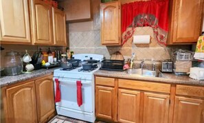 Fridge, microwave, oven, cookware/dishes/utensils