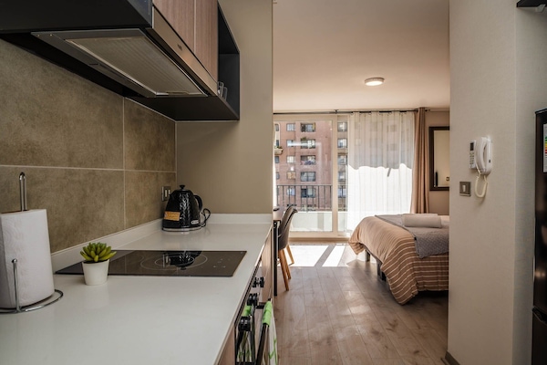 Full-sized fridge, microwave, stovetop, coffee/tea maker