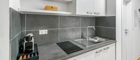 Fridge, microwave, stovetop, coffee/tea maker