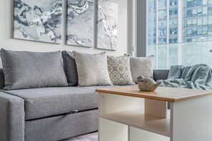 Suite Confort, vistas a la ciudad | Zona de estar