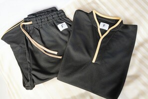 Two pieces of athletic wear with a tag and a zipper. - Hotel KAN-RAKU Premier Utsunomiya-Eki (Utsunomiya)