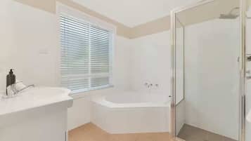 Shower, hair dryer, towels, shampoo