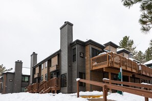A multi-story building with a wooden deck and a chimney. - Canyons Retreat: Alpine Charm, Shared Hot Tub/Pool, Sleeps 10, Cozy Fireplace (Park City)