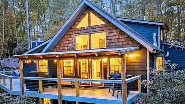 A wooden cabin with a deck, large windows, and a chimney. - 3 BR Beech Mtn Basecamp: 2 Mi to Resort, Fireplace & Firepit (Beech Mountain)