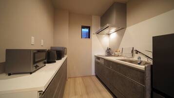 Comfort Condo, Balcony | Private kitchen | Full-size fridge, microwave, stovetop, rice cooker
