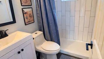 Shower, hair dryer, towels, shampoo