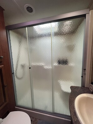 Shower, hair dryer, towels, soap