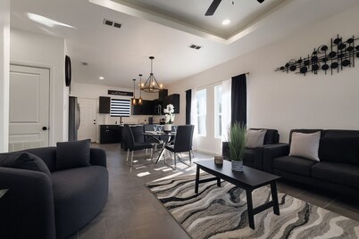 Noir: Stylish 3BR w'TV's All Rooms +Workspace & Yard