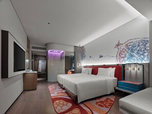 A modern hotel room with a large bed, a flat-screen TV, a vanity with a mirror, and a decorative wall mural. - Dhawa Xi'an Chanba (Xi'an)
