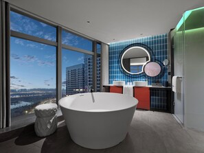 A modern bathroom with a large bathtub, dual sinks, and a large mirror. - Dhawa Xi'an Chanba (Xi'an)
