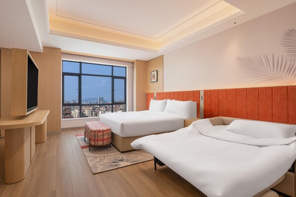 A hotel room with two beds, a TV, and a large window with a city view. - Hilton Garden Inn Dongguan Wanjiang Jiangjing Road (Dongguan)