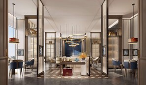 Un intérieur moderne avec un espace de repas central, de nombreux coins salon et des luminaires contemporains.