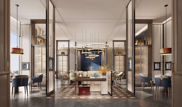 A modern interior with a central dining area, multiple seating options, and contemporary lighting fixtures. - Doubletree by Hilton Zhengzhou Airport Aerotropol (Zhengzhou)