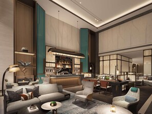 Eine moderne Hotelhalle mit Bar, Sitzgelegenheiten und einem Essbereich.