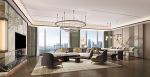 Ein modernes Wohnzimmer mit Blick auf die Stadt, einem großen Flachbildfernseher und einem Essbereich mit Tisch und Stühlen.