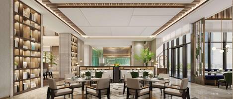 A modern hotel lobby with a central dining area, large windows, and a bookshelf.