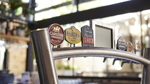 A bar with three taps labeled 'Carlton Draught,' 'Bulmers,' and 'James Squire Ginger.' - Blue Gums Hotel (Adelaide)