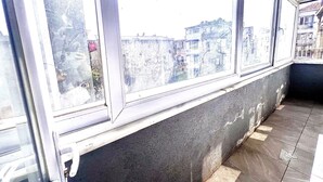 A corner of a room with a window overlooking a cityscape. - Taksim Capital Hotel (Istanbul)