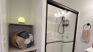 Shower, hair dryer, towels