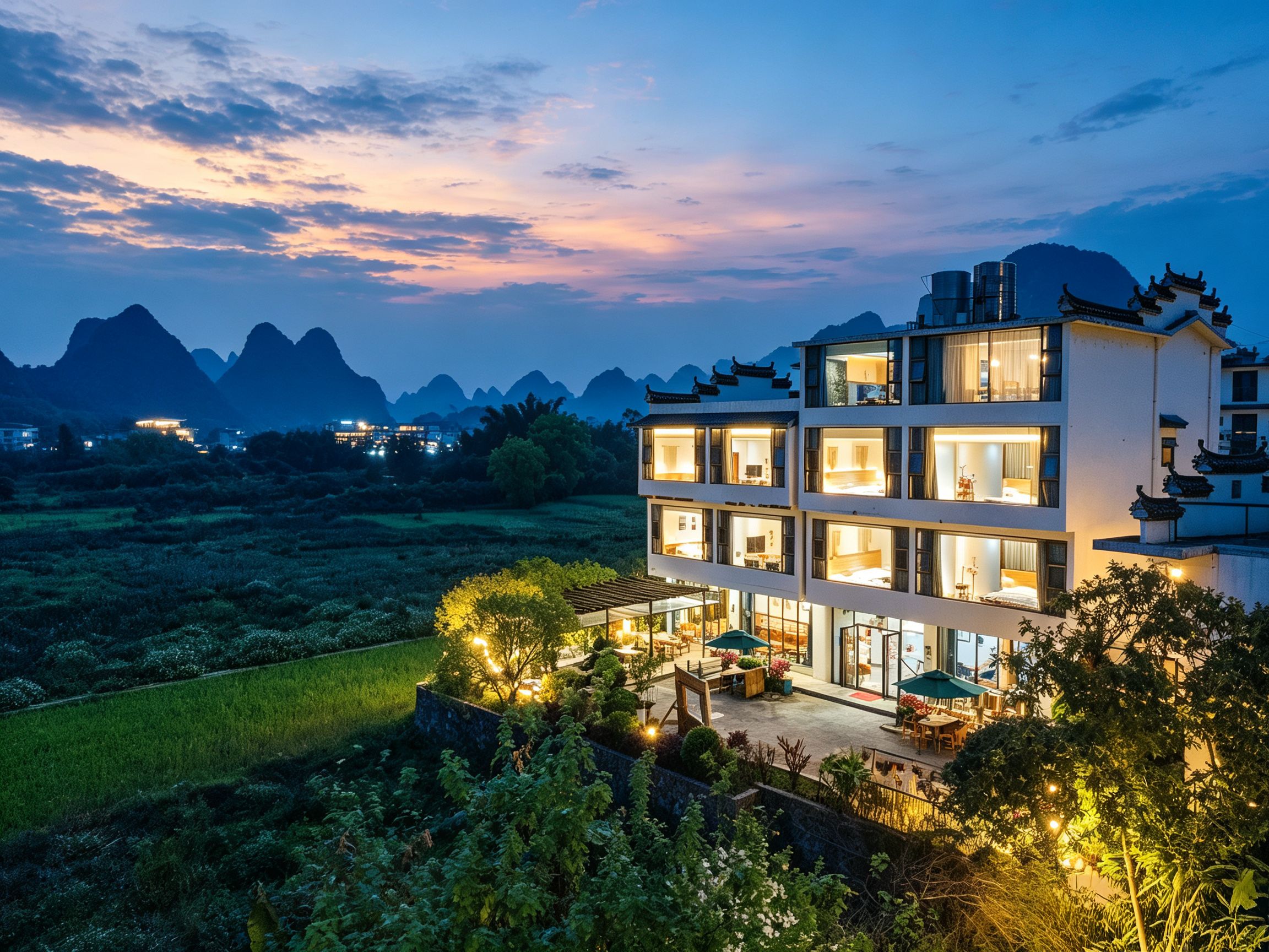 A multi-story hotel with a modern design, featuring multiple balconies and large windows.